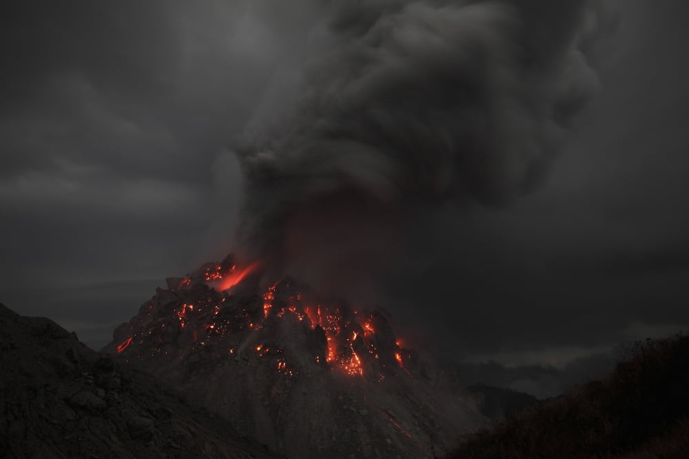 Glowing Rerombola lava dome of Paluweh volcano Indonesia Canvas Art - Richard RoscoeStocktrek Images (35 x 23)