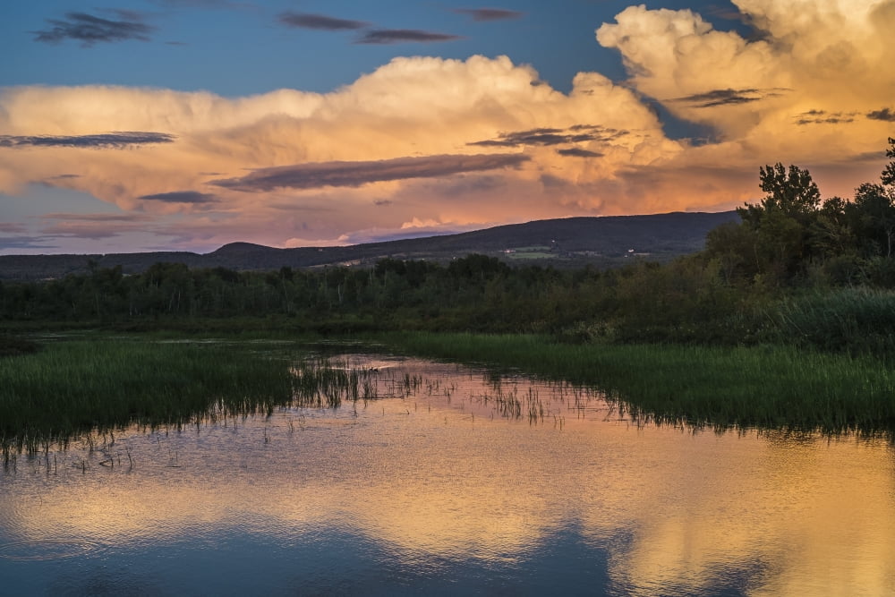 Glowing cloud reflected in tranquil Lake Brome Quebec Canada Canvas Art - Jacques Laurent Design Pics (38 x 24)