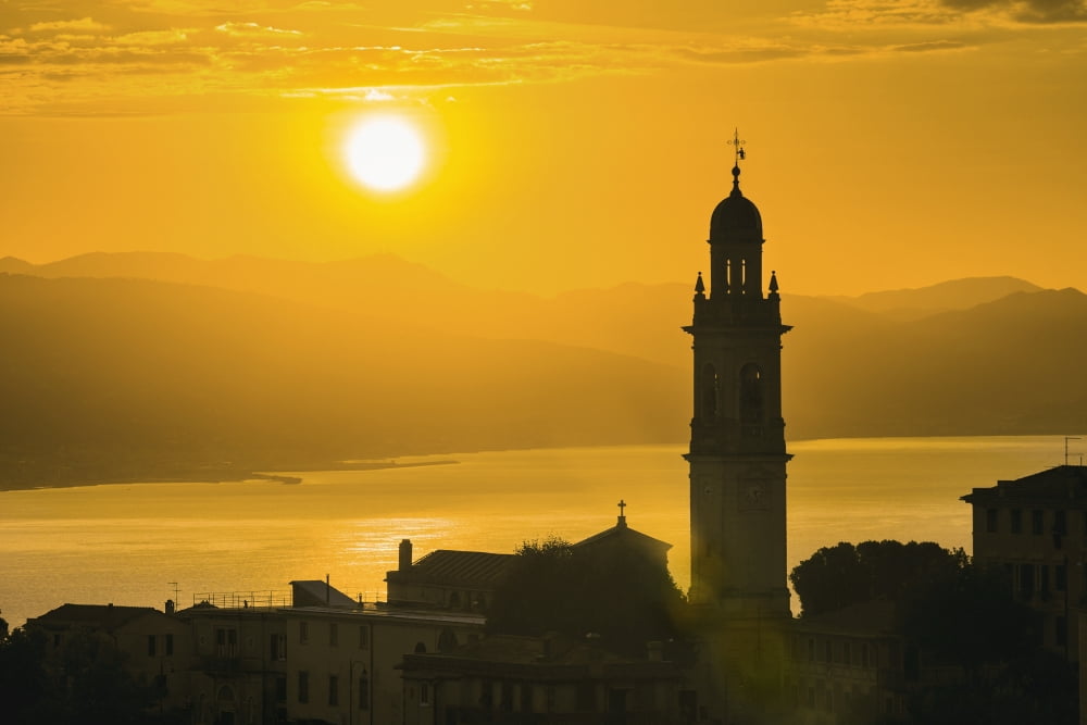 Golden sky at dusk with tower of church San Lorenzo della Costa Liguria Italy Canvas Art - Yves Marcoux Design Pics (19 x 12)