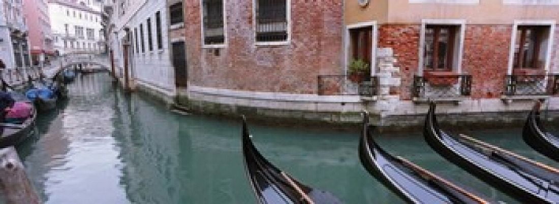 Gondolas in a canal Grand Canal Venice Italy Canvas Art - Panoramic Images (18 x 7)