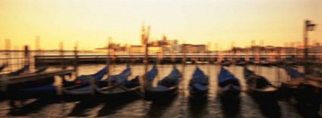 Gondolas in a canal Venice Italy Canvas Art - Panoramic Images (18 x 7)