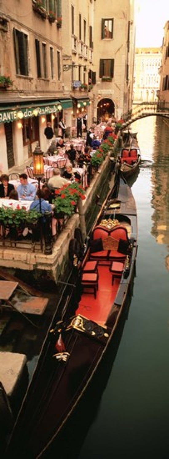 Gondolas moored outside of a cafe Venice Italy Canvas Art - Panoramic Images (18 x 7)