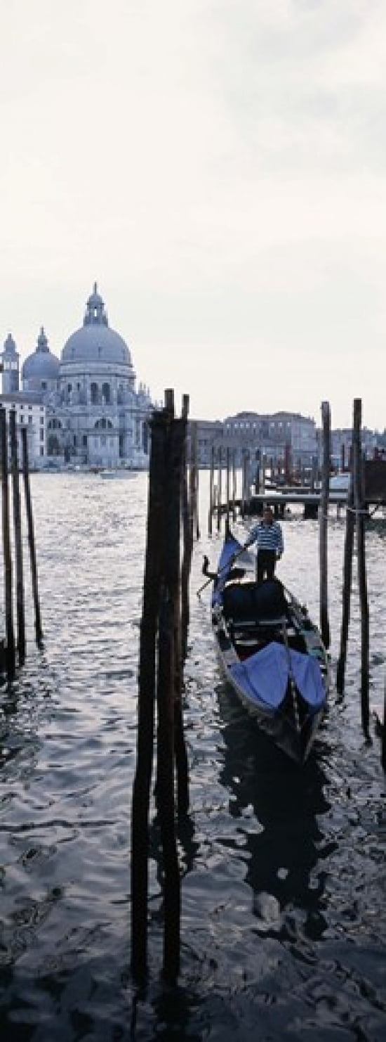Gondolier in a gondola with a cathedral in the background Santa Maria Della Salute Venice Veneto Italy Canvas Art - Panoramic Images (18 x 7)