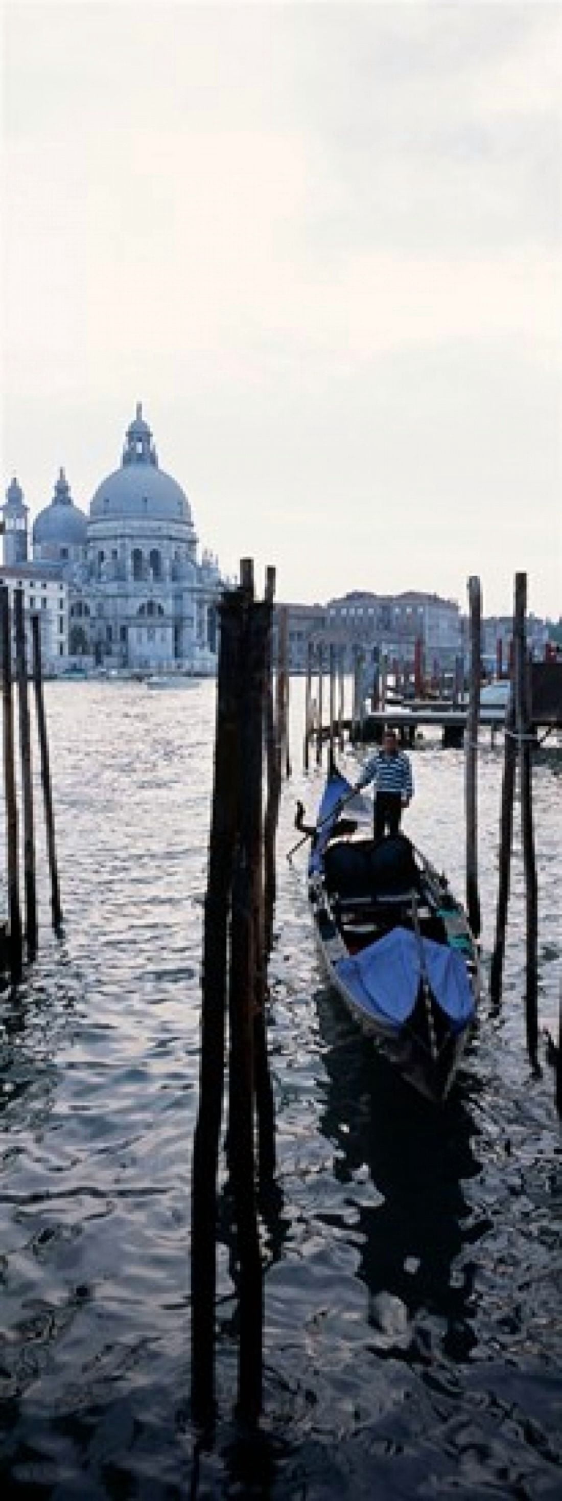 Gondolier in a gondola with a cathedral in the background Santa Maria Della Salute Venice Veneto Italy Canvas Art - Panoramic Images (36 x 13)