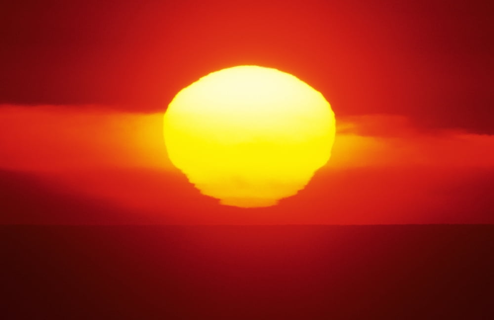 Gorgeous Sun Setting In Bright Orange Sky Over Ocean Canvas Art - Larry Dale Gordon Design Pics (17 x 11)