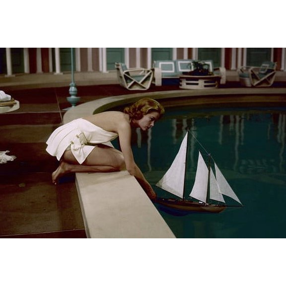 Grace Kelly bare shoulder leaning over pool toy sailboat 24x36 Poster