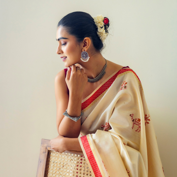 Graceful Ivory Traditional Saree with Red Border Detailing and Delicate Ethnic Motifs for Festive Elegant Occasions