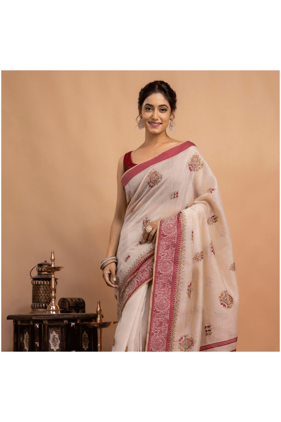 Graceful in Traditional Cream and Red Saree with Intricate Embroidery and Timeless Ethnic Elegance Indoors Setting