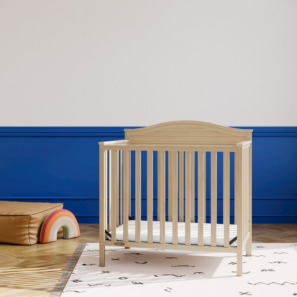 Graco Stella 4-in-1 Convertible Baby Mini Crib with Mattress, Driftwood