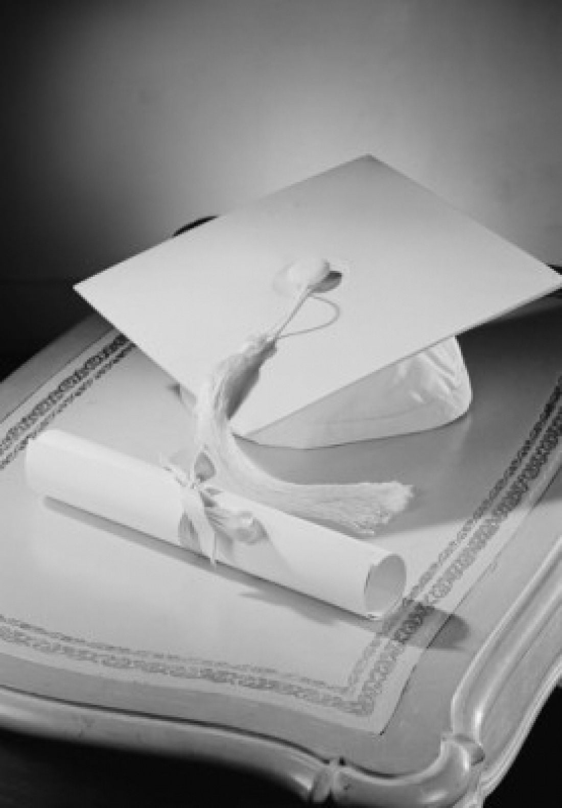 Graduation diploma and mortar board on bedside table Canvas Art - (18 x 24)