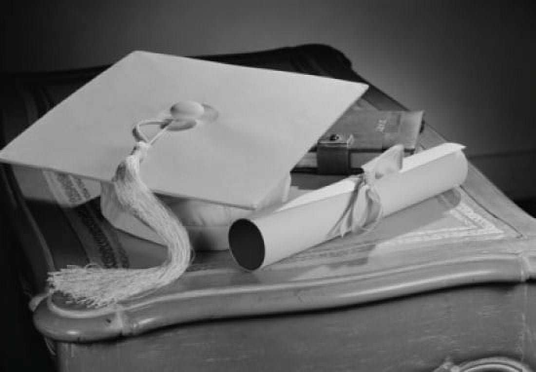 Graduation diploma and mortar board on bedside table Canvas Art - (18 x 24)