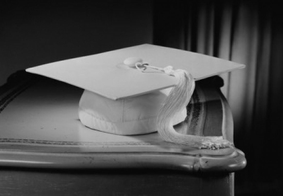 Graduation mortar board on bedside table Canvas Art - (18 x 24)
