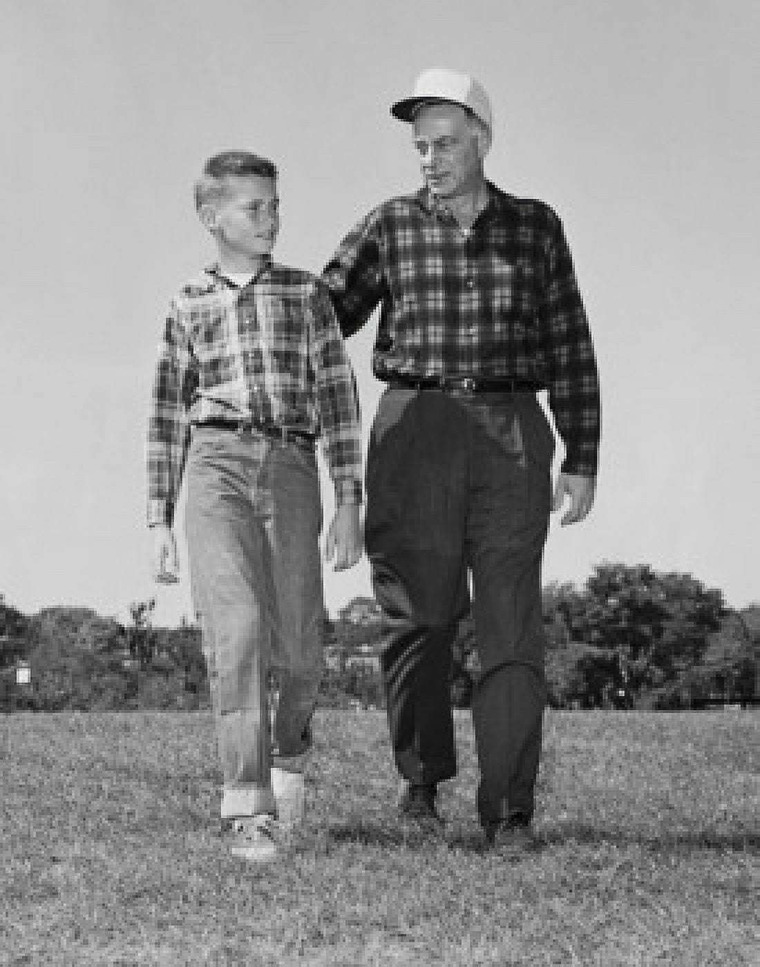 Grandfather and his grandson walking in a park Canvas Art - (18 x 24)
