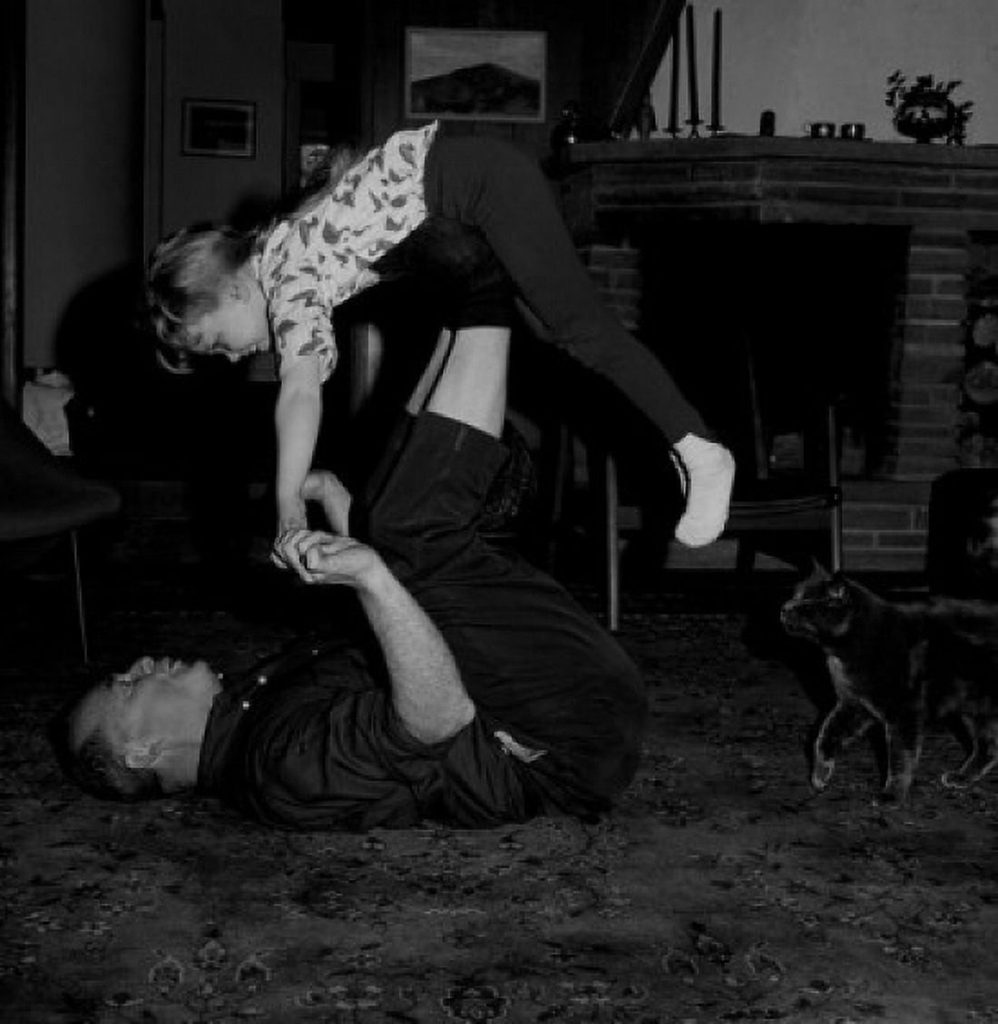 Grandfather playing with granddaughter on carpet Canvas Art - (24 x 36)
