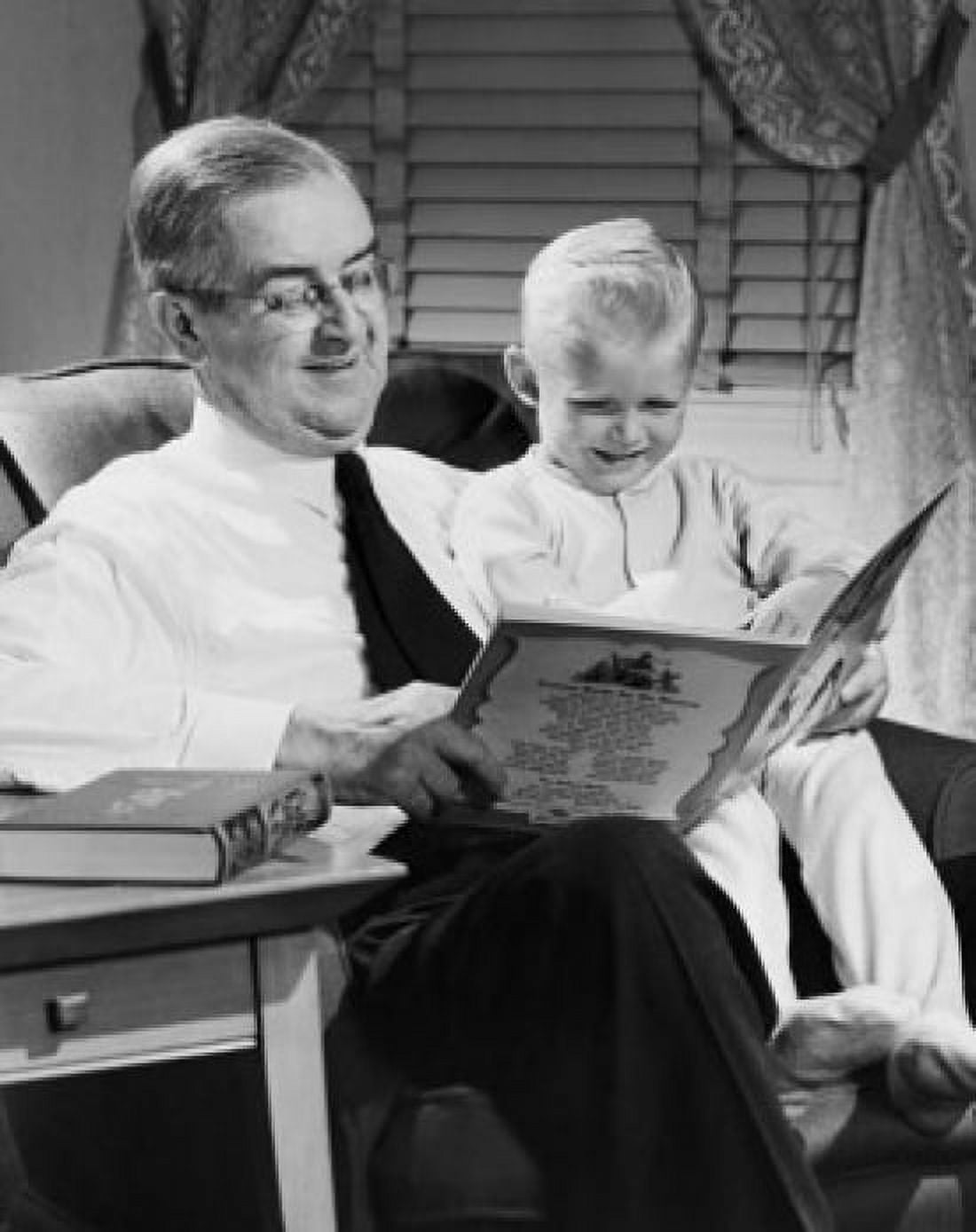 Grandfather reading story to grandson Canvas Art - (24 x 36)