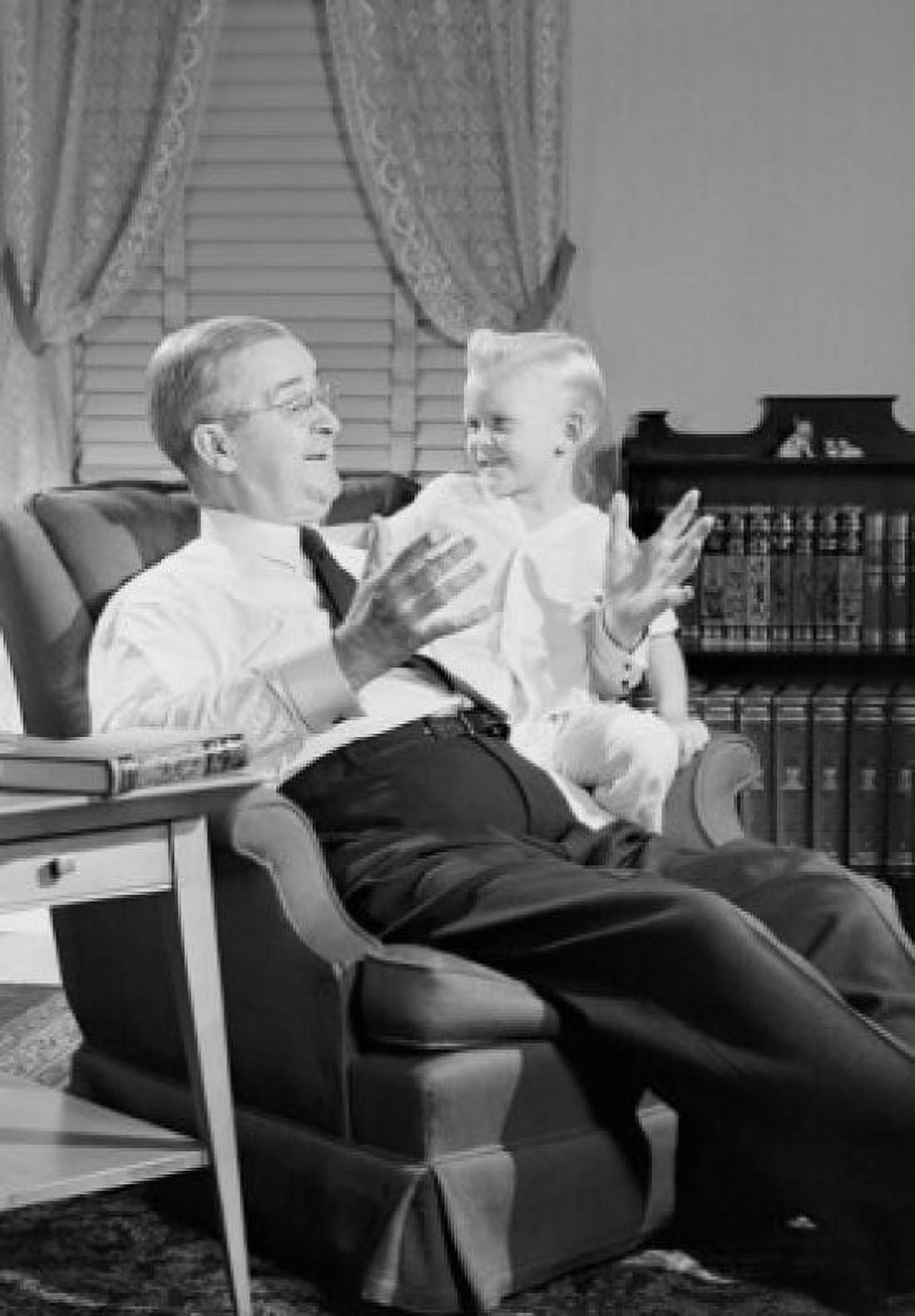 Grandfather talking with grandson in living room Canvas Art - (18 x 24)