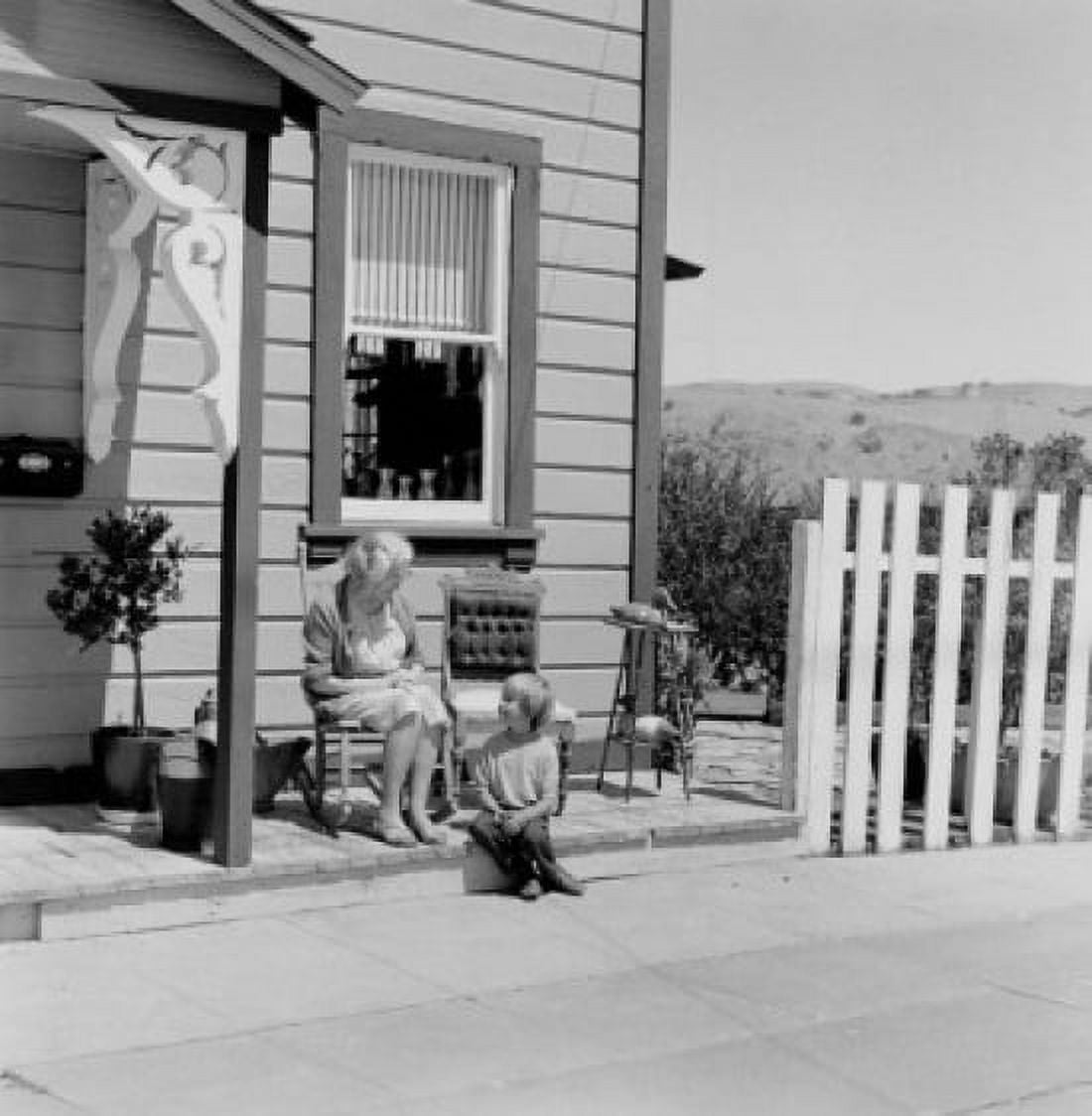 Grandmother and grandson sitting outside house Canvas Art - (24 x 36)