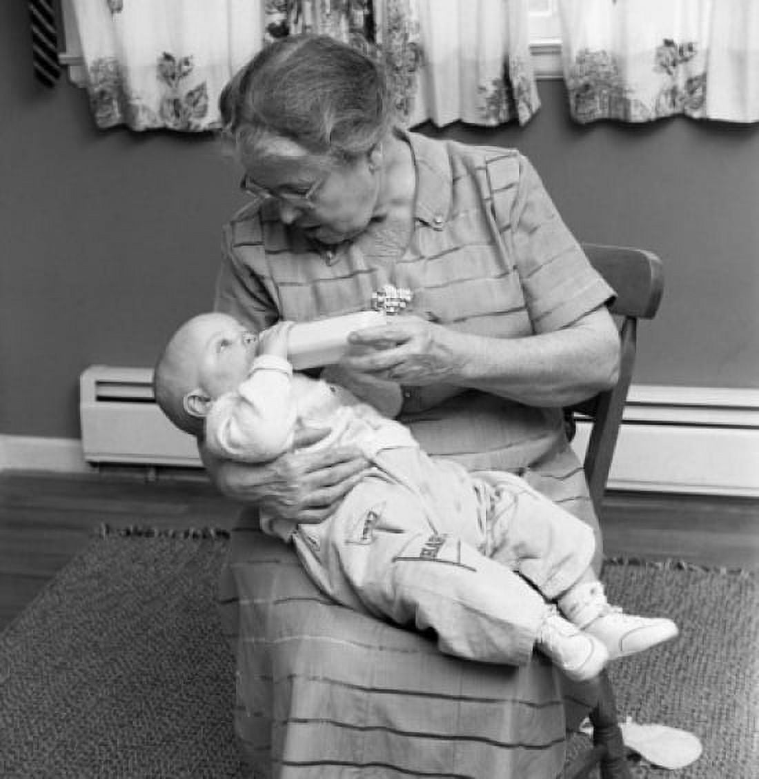 Grandmother feeding baby Canvas Art - (18 x 24)