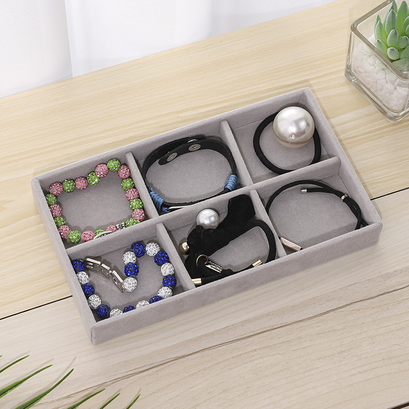 Gray flannel tray in drawer jewelry stud earrings ring necklace jewelry