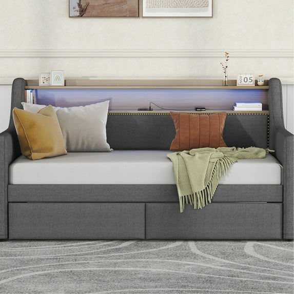 Gray linen twin daybed with storage drawers charging USB ports and adjustable LED lights for a cozy and organized room