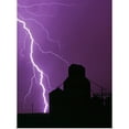 thumbnail image 1 of Great BIG Canvas | Rolled Dave Reede Poster Print entitled A bolt of lightning lights up the night sky during a storm silhouetting a grain, 1 of 4