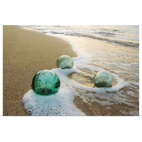 Great BIG Canvas | Rolled Mary Van de Ven Poster Print entitled Three Glass Fishing Floats Roll On The Sandy Shoreline With Ripples Of Water And