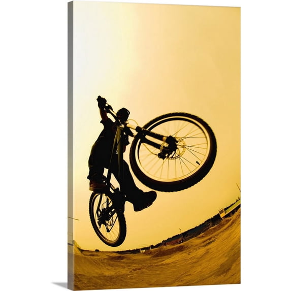 Great BIG Canvas | "Silhouette Of A Cyclist Against A Yellow Sky" Canvas Wall Art - 20x30