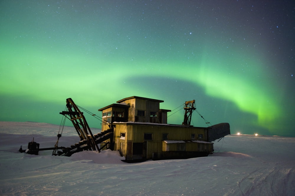 Green Northern Lights Dance Over A Historical Gold Dredge Near Nome Alaska Canvas Art - Daryl Pederson Design Pics (19 x 12)