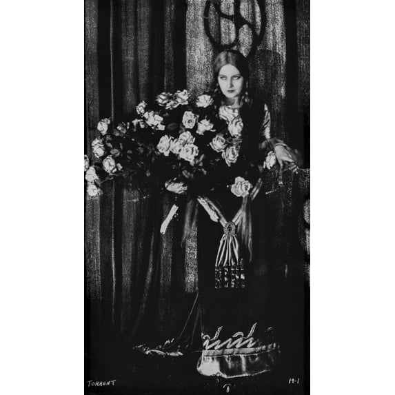 Greta Garbo standing with Bouquet of Flowers Photo Print (24 x 30)