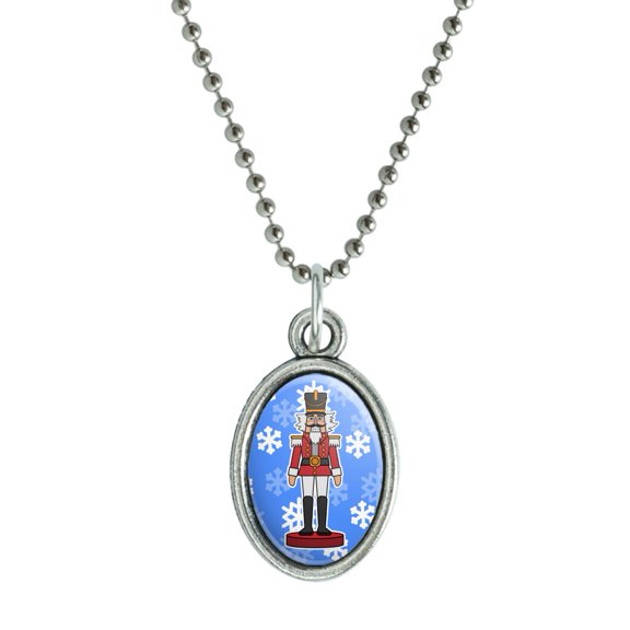Grinning Nutcracker Soldier with Snowflakes Antiqued Oval Charm Pendant with Chain