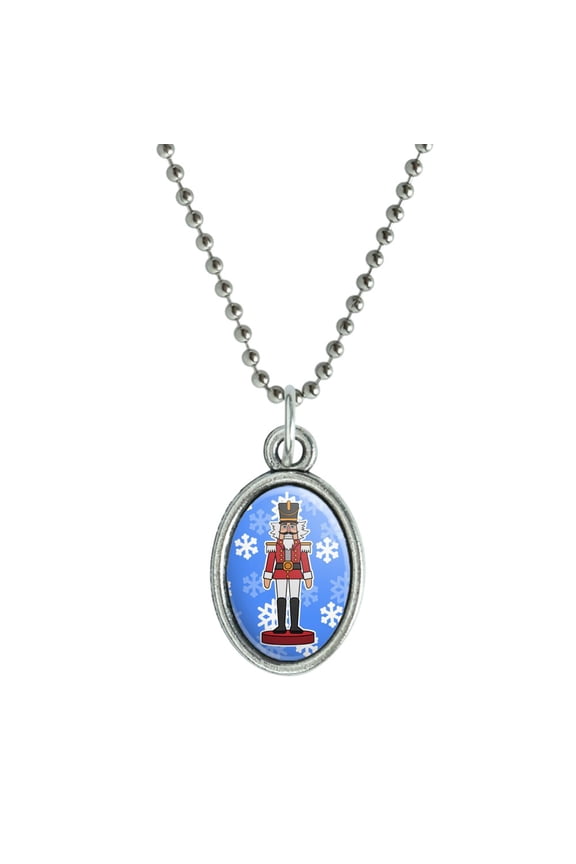 Grinning Nutcracker Soldier with Snowflakes Antiqued Oval Charm Pendant with Chain
