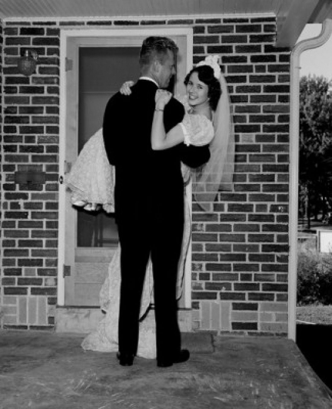 Groom carrying bride Canvas Art - (18 x 24)
