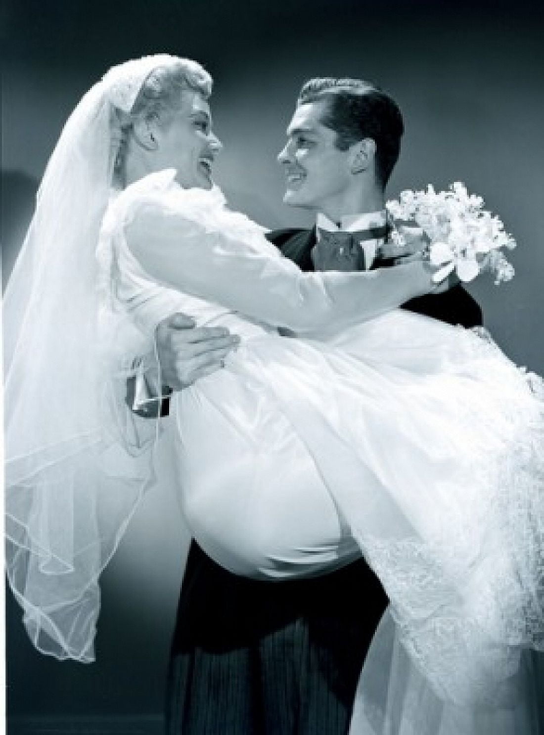 Groom embracing bride holding bouquet Canvas Art - (24 x 36)