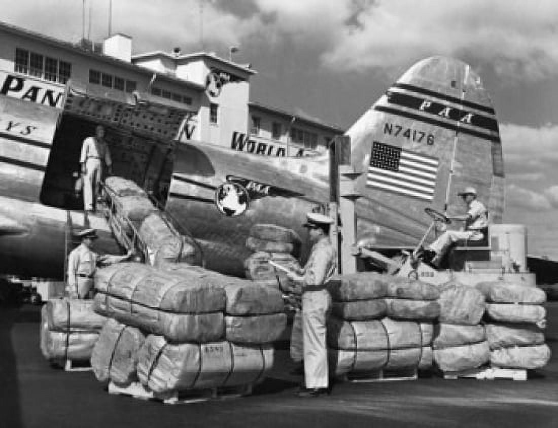 Ground crews loading cargo in an airplane Miami Florida USA Canvas Art - (18 x 24)