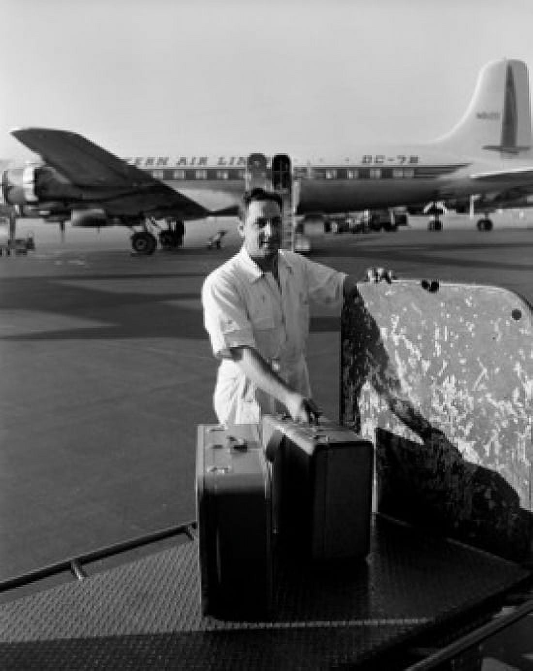 Ground staff man at airport with suitcase Canvas Art - (18 x 24)