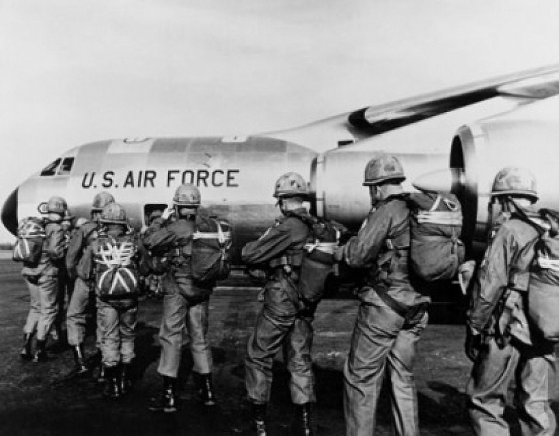 Group of paratroopers standing in a row near a military airplane 101st Airborne Division Fort Campbell Kentucky USA Canvas Art - (24 x 36)