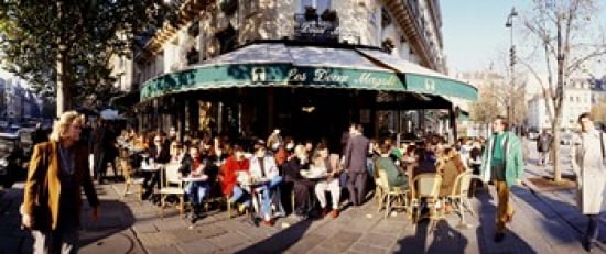 Group of people at a sidewalk cafe Les Deux Magots Saint-Germain-Des-Pres Quarter Paris France Canvas Art - Panoramic Images (30 x 13)