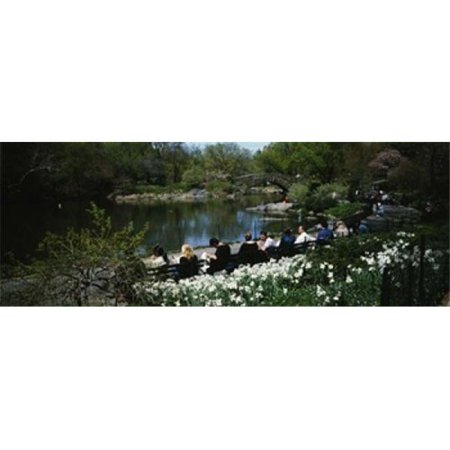 Group of people sitting on benches near a pond Central Park Manhattan New York City New York State USA Poster Print by - 36 x 12