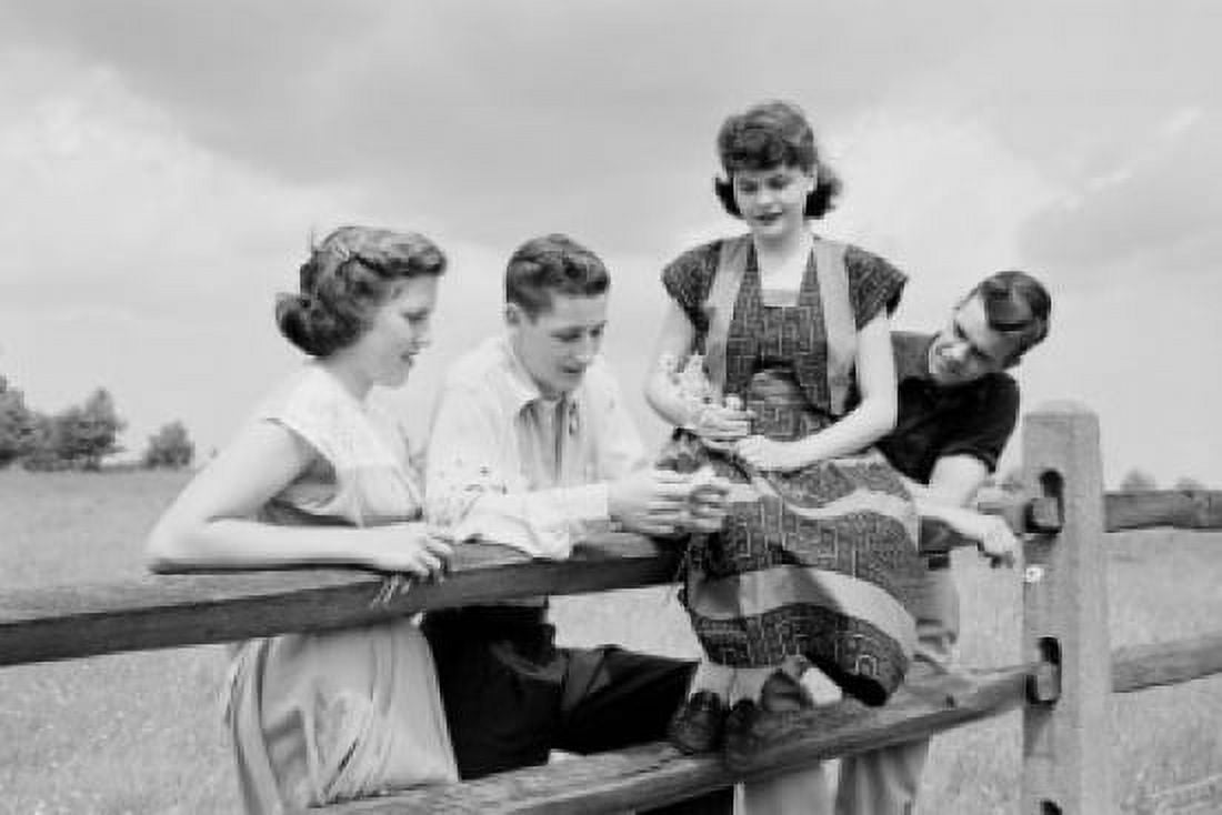 Group of young people by wooden fence Canvas Art - (24 x 36)