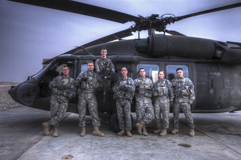 Group photo of UH-60 Black Hawk pilots and crew chiefs Canvas Art - Terry MooreStocktrek Images (18 x 12)