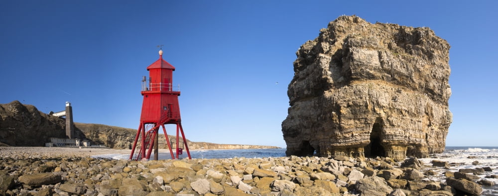 Groyne lighthouse beside a rock formation along the shoreline South Shields Tyne and Wear England Canvas Art - John Short Design Pics (44 x 18)