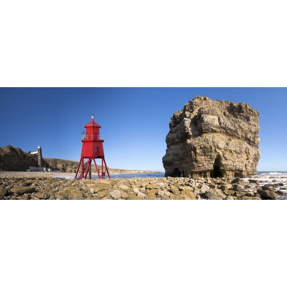Groyne lighthouse beside a rock formation along the shoreline; South Shields, Tyne and Wear, England Poster Print (34 x 13)