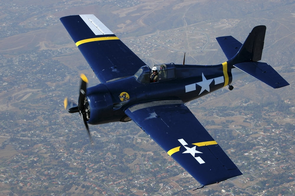 Grumman F4F Wildcat flying over Chino California Canvas Art - Phil WallickStocktrek Images (34 x 23)