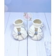 thumbnail image 1 of Gum Paste Baby Girl White Shoes with “Fabric Bow” Cake Topper, 1 of 6