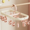 thumbnail image 1 of Gumesh Foldable Clothes Drying Rack with Clips - Space Saving Indoor Laundry Rack, Perfect for Apartments, Dorm & Small Spaces(Pink), 1 of 5