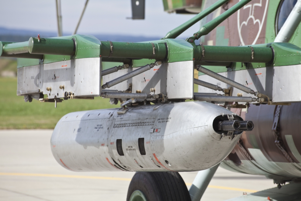 Gun pod on a Slovakian Mi-17 helicopter Canvas Art - Timm ZiegenthalerStocktrek Images (35 x 24)