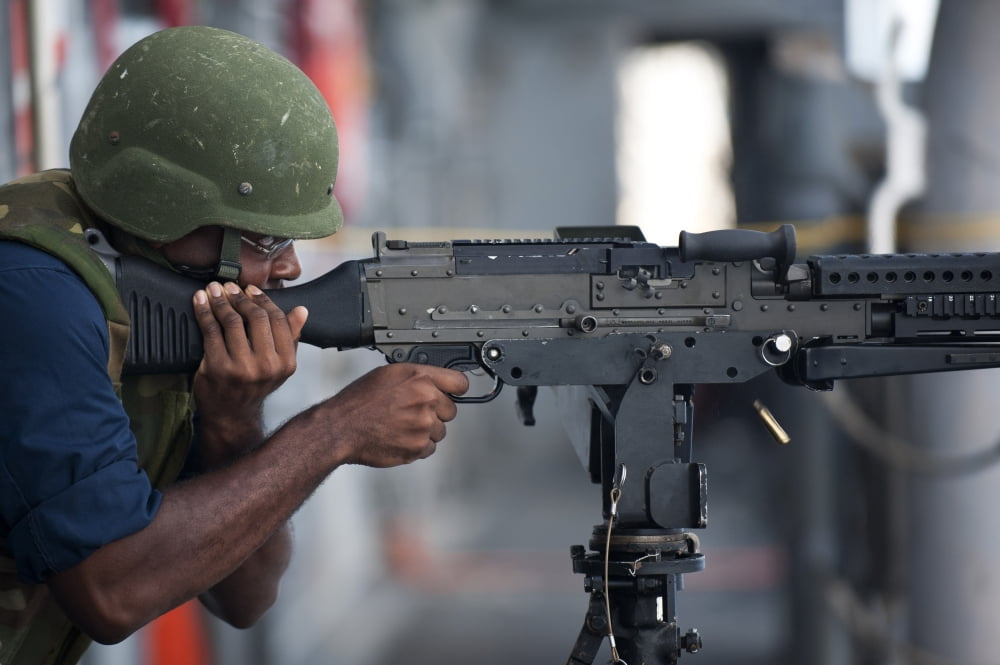 Gunners Mate fires an M240G light machine gun Canvas Art - Stocktrek Images (35 x 23)