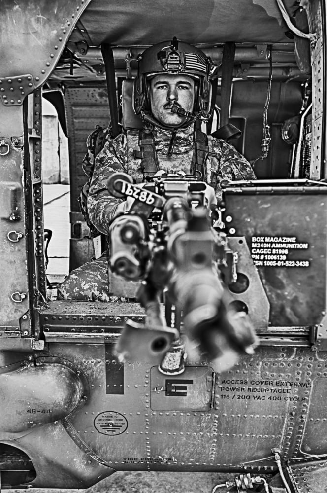 HDR image of a UH-60 Black Hawk door gunner manning a M240 machine gun Canvas Art - Terry MooreStocktrek Images (12 x 18)