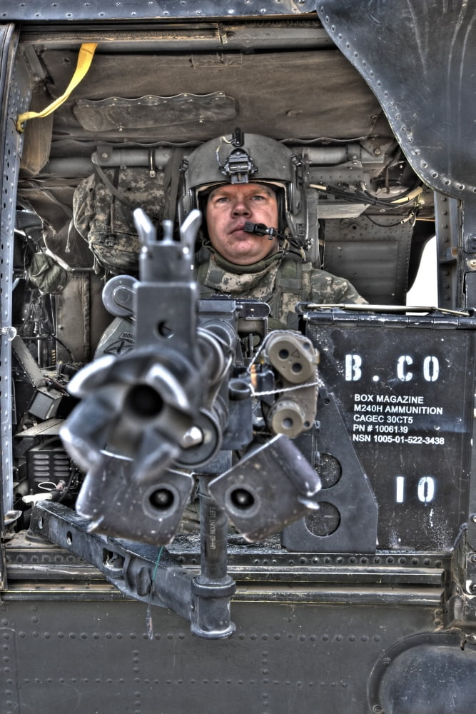 HDR image of a UH-60 Black Hawk door gunner manning a M240 machine gun Canvas Art - Terry MooreStocktrek Images (12 x 18)