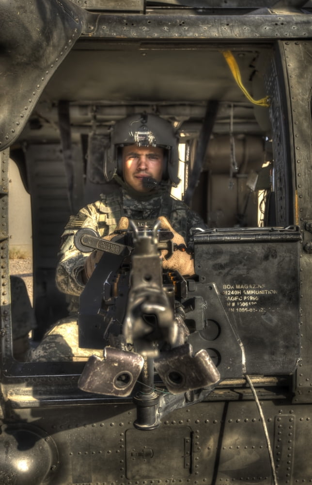 HDR image of a UH-60 Black Hawk door gunner manning a M240 machine gun Canvas Art - Terry MooreStocktrek Images (23 x 35)